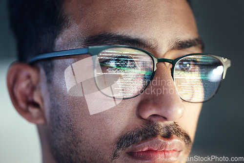 Image of Glasses, man and reflection of programmer on computer working on software, code and data. IT, engineer and serious face of developer with information technology for cloud computing in office closeup.