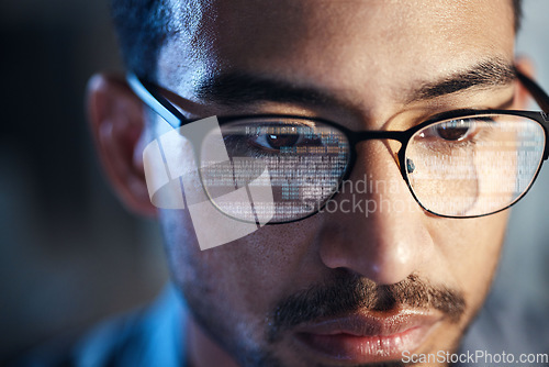 Image of Glasses, man and reflection of code on computer working on software, programming and data. IT, engineer and serious face of developer with information technology for cyber security in office closeup