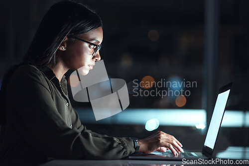 Image of Laptop, research and business woman in coding, software development and programming for night cybersecurity. Computer, typing and screen reflection, focus and data analysis of programmer or IT person