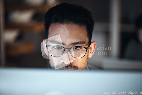 Image of Computer, research and man in glasses for software development, night programming and cybersecurity. Reading, focus and person or programmer with data analysis, desktop system and coding information