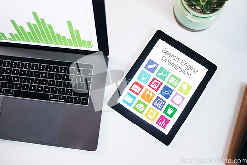 Image of Seo, tablet and laptop screen with data in top view in office, company or workplace. Computer desk, tech and statistics, graphs and chart for analytics, ui or icons for marketing, advertising or app.