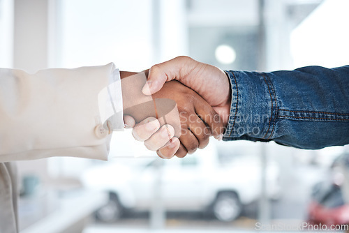 Image of Business people, handshake and meeting in partnership, support or trust for teamwork or unity at the office. Employees shaking hands for introduction or greeting in agreement or deal at the workplace