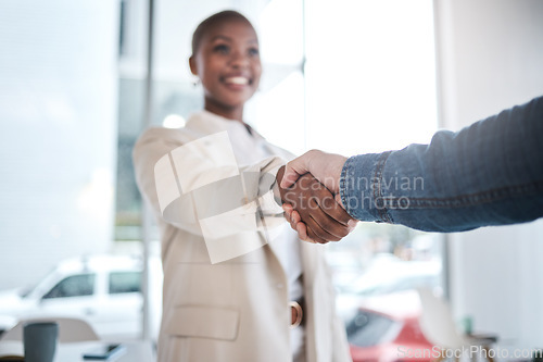 Image of Black woman, handshake and meeting in partnership, support or trust for teamwork or unity at office. African female person or employee shaking hands for introduction, agreement or deal at workplace