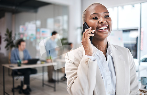 Image of Phone call, funny and black woman in office for communication, conversation or chat. Smartphone, happy or African business professional listen, laugh or discussion with contact in coworking workplace