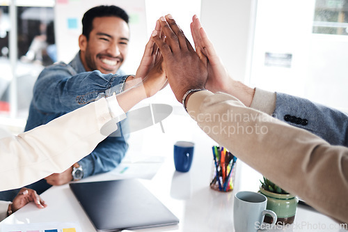 Image of Creative people, meeting and high five for team building, success or achievement at the office. Happy group with hands together for teamwork, celebration or support in trust or startup at workplace
