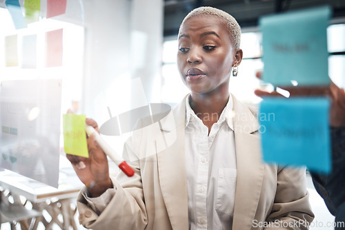 Image of Black woman, sticky note and schedule planning for brainstorming, teamwork or tasks at the office. African female person or employee working on team strategy, ideas or business agenda at workplace