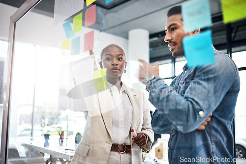 Image of Creative people, thinking and meeting for schedule planning, brainstorming or team strategy at the office. Man and woman in teamwork decision for project plan, tasks or sticky note ideas in startup