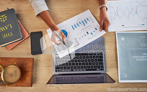 Image of Documents, data analysis and person hands for legal statistics, crime report and charts or graphs above. Laptop, paperwork and infographics of lawyer, people or attorney hands for social media policy