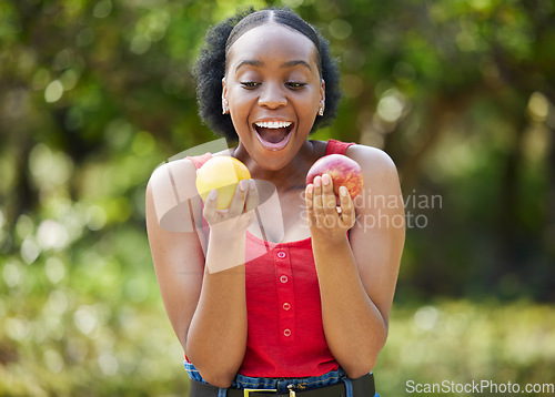Image of Happy black woman, lemon and apple in surprise for vitamin C, natural nutrition or diet in nature. African female person with citrus and organic fruit for healthy eating, fiber and wellness outdoors