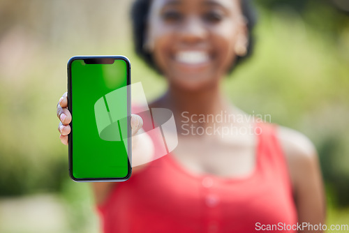 Image of Woman, hands and phone mockup green screen for advertising, mobile app or communication in nature. Female person show smartphone display or chromakey for advertisement or marketing in the outdoors