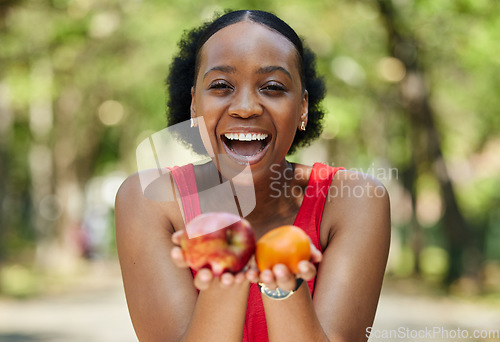 Image of Apple, orange and portrait of a black woman with a fruit on a farm with fresh produce in summer and smile for wellness. Citrus, nutrition and young female person on an organic diet for self care