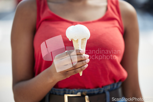 Image of Hands, woman and vanilla ice cream for dessert, cool snack and sweet food outdoor in city street, vacation or travel. Closeup, female person and eating frozen cone, melting gelato and dripping summer