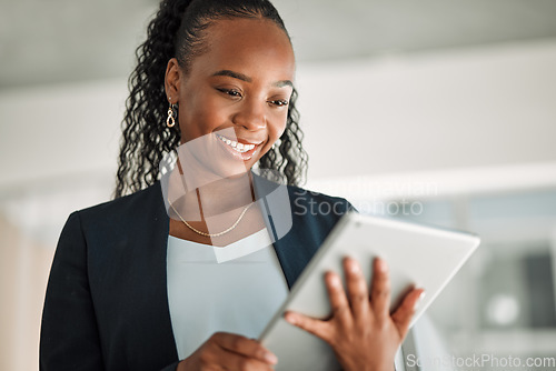 Image of Lawyer, smile and black woman with tablet in office for legal research, online app and social media. African attorney, technology and happy professional reading business email, networking or internet