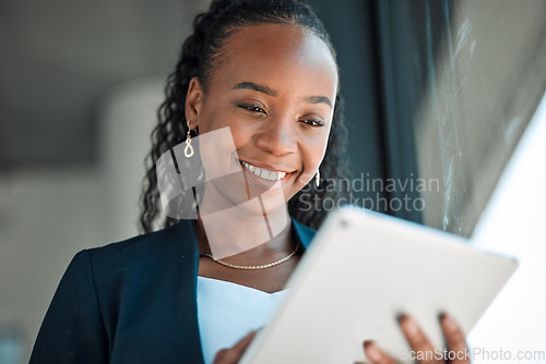 Image of Happy, lawyer and black woman with tablet in office for legal research, web app and online social media. African attorney, technology and professional reading business email, networking or internet.