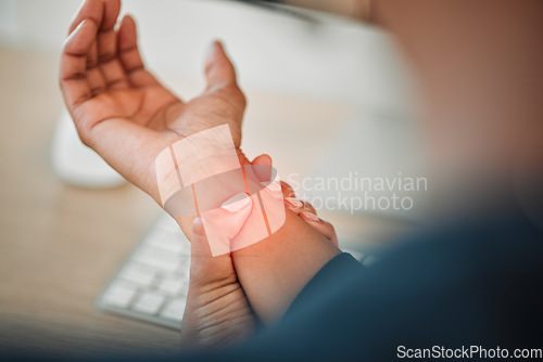 Image of Hands, business or person with wrist pain while working on a computer in office workplace with red glow or injury. Hurt, carpal tunnel syndrome or closeup of injured worker with discomfort arm cramp