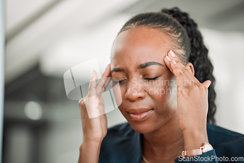 Image of Stress, head pain or black woman in office with headache due to burnout or fatigue from deadline. Migraine, crisis or tired African female consultant depressed or frustrated by anxiety in workplace