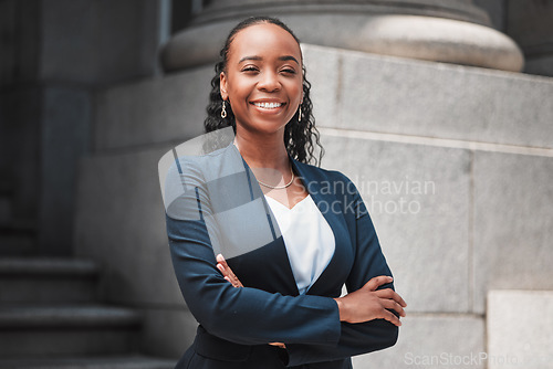 Image of Arms crossed, attorney or portrait of happy black woman with smile or confidence working in a law firm. Confidence, empowerment or proud African lawyer with leadership or vision for legal agency