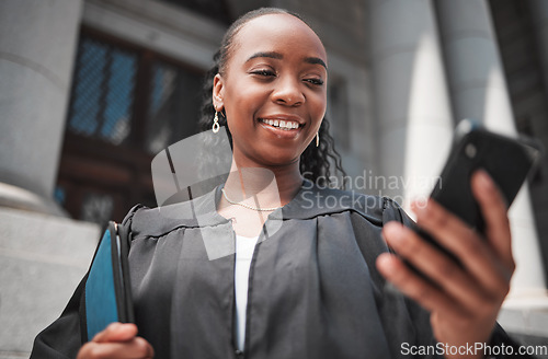 Image of Lawyer, judge at court and phone to contact a client, communication or legal services and advice on mobile app online. Smile, black woman and smartphone for research, information or consulting law