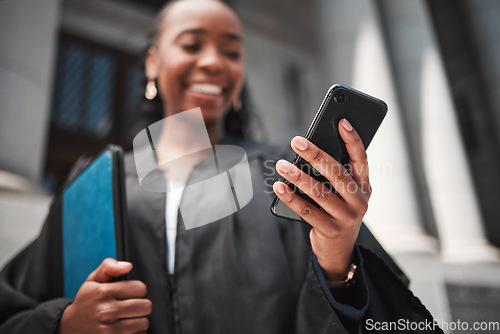 Image of Judge at court, hand and phone to contact a client, communication or legal services and advice on mobile app online. Smile, black woman and smartphone for research, information or consulting law
