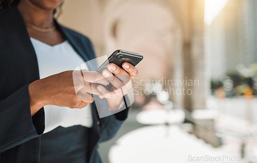 Image of Woman, hands and phone in city for social media, communication or networking outdoors. Closeup of female person chatting, texting or typing on mobile smartphone app for online browsing in urban town