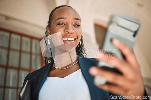 Image of Phone, commute and a business black woman in the city, searching for directions or typing a message. Mobile, travel and gps with a young female employee looking for a location on a navigation app