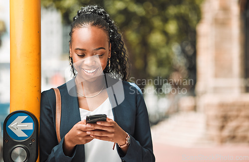 Image of Happy black woman, phone and city in travel, social media or communication in Cape Town. African female person with smile for chatting, texting or networking on mobile smartphone app by traffic light