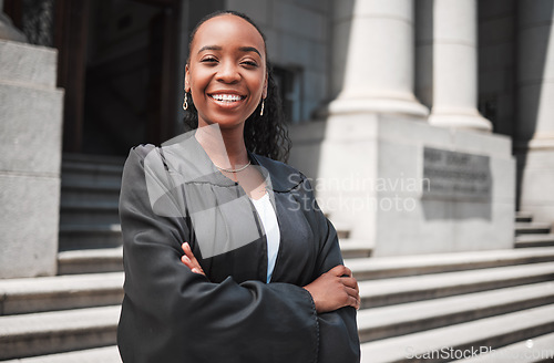 Image of Arms crossed, black woman or portrait lawyer with confidence, empowerment or justice outside court. Happy, empowerment or proud African attorney with leadership, ideas or vision for legal agency