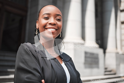 Image of Happy, black woman or portrait lawyer with confidence, empowerment or justice outside court. Face, empowerment or proud African attorney with leadership, arms crossed or vision for legal agency