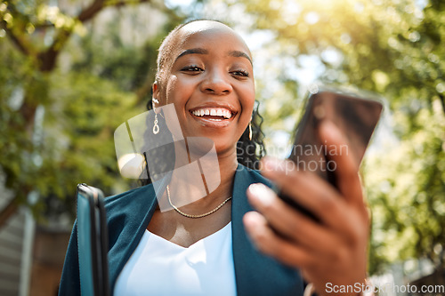 Image of Happy black woman, phone and city for social media, communication or online browsing at the park. African female person with smile for chatting, texting or networking on mobile smartphone app outside
