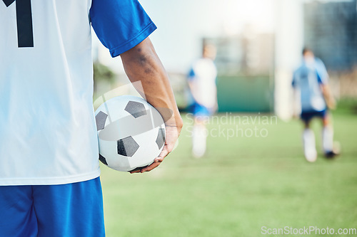 Image of Back,, sports or man with a soccer ball on a field for exercise, fitness and training outdoors. Football club, ready or healthy athlete in a game for competition event or match contest in stadium