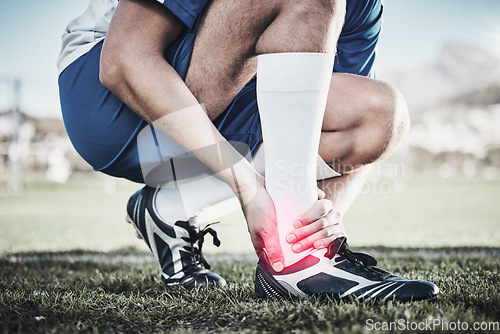 Image of Injury, sports and hand of a man on foot pain, soccer emergency and accident while training. Fitness, problem and an athlete or football player with inflammation or a swollen muscle on the field