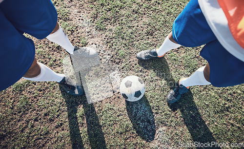 Image of Legs, soccer and ball with a team ready for kickoff on a sports field during a competitive game from above. Football, fitness and teamwork on grass with players standing on grass to start of a match