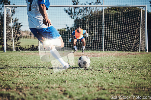 Image of Fitness, penalty and soccer player scoring a goal at training, game or match at a tournament. Sports, exercise and back of male football athlete kick ball at practice on outdoor field at stadium.