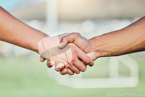 Image of Football, team handshake and partnership at stadium for sports deal, support or agreement. Collaboration, shaking hands and soccer players welcome to game, competition and workout for exercise match.