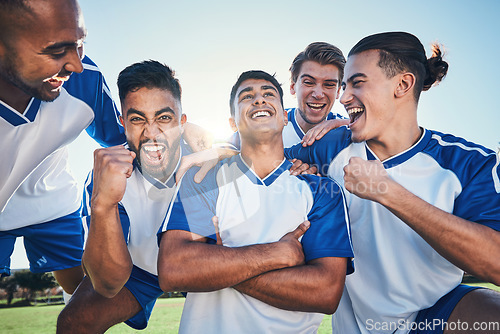 Image of Win, football player and men celebrate together on a field for sports and fitness achievement. Happy male soccer team or athlete group with fist for challenge, competition or pride outdoor on pitch