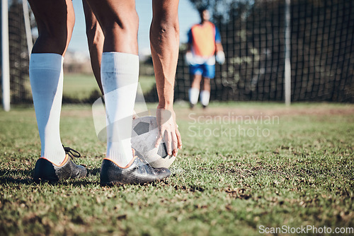 Image of Soccer ball, sports and feet of person to kick on field, fitness training or shoot for a goal in the net. Football, player and legs of athlete in exercise, competition or sport challenge for goals