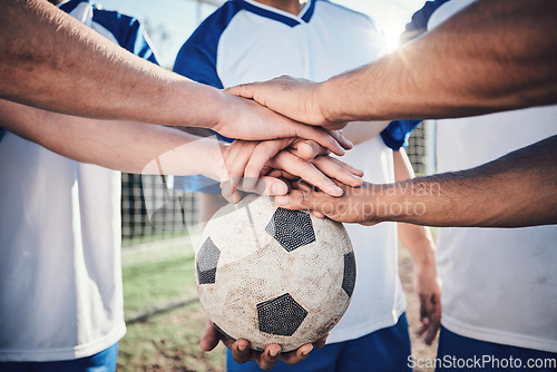 Image of Football, hands together and collaboration for support, sports and training at stadium. Teamwork, group huddle and soccer players with motivation for exercise, workout goal and success in competition