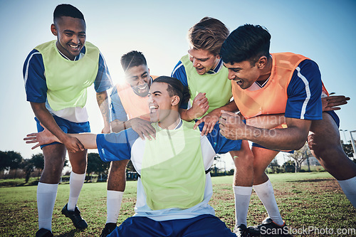 Image of Football team, game and men celebrate together on a field for sports and fitness win. Happy male soccer player or athlete group for challenge, training or performance achievement outdoor on pitch