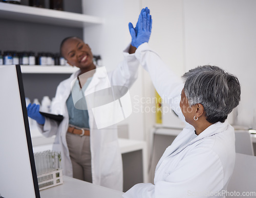 Image of Women, scientist and high five with success in laboratory, teamwork and scientific breakthrough in medical research. Collaboration, science and biotechnology, female doctors has support and celebrate