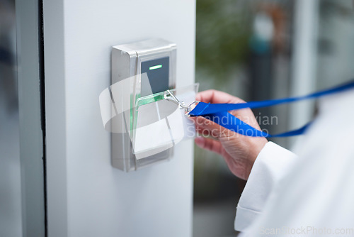 Image of Hand, key card and scan for security door, entrance or access control for safety in business, facility and property. Hands, electronic keys and laser reader or technology to lock or secure laboratory