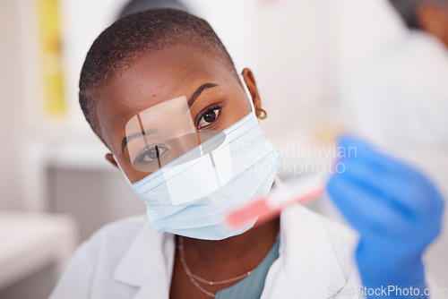 Image of Black woman, face and mask for blood test, science and innovation in vaccine, research or working with virus dna sample. Tube, container and hand of scientist or medical expert with biotechnology