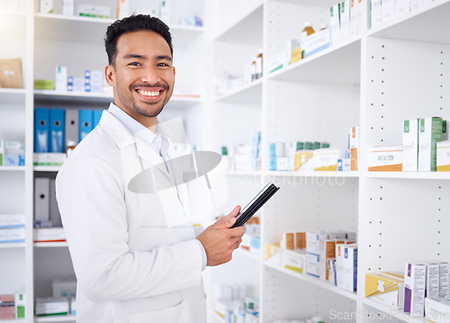 Image of Man, portrait and pharmacist with tablet in pharmacy, drugstore or shop. Face, technology and Asian medical professional, happy doctor or worker with a pharmaceutical job for healthcare in Cambodia