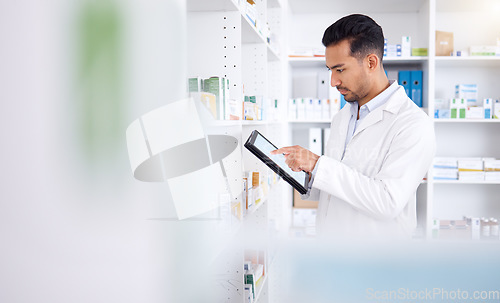 Image of Pharmacist, medicine and Asian man with tablet to check inventory, stock or healthcare for online prescription. Pharmacy, medical worker or employee with pills, health products or internet connection