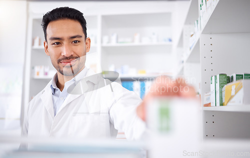 Image of Asian man, pharmacist and medicine for stock check at pharmacy, drugstore or shelf. Medical professional, inventory pills or doctor with pharmaceutical drugs, medication or supplements for healthcare