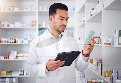 Image of Man, pharmacist and tablet for medicine, stock check and reading in pharmacy store. Technology, inventory pills and medical doctor with pharmaceutical drugs, medication or supplements for healthcare.