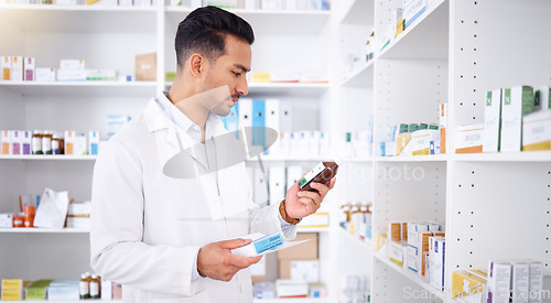 Image of Pharmacist, medicine and man with bottle to check stock in pharmacy store. Medication, inventory and medical doctor reading label on pharmaceutical drugs, supplements and information for healthcare.