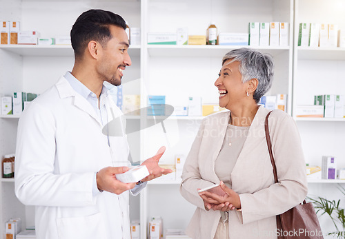 Image of Pharmacist man, senior woman and talking with box, phone or funny in store for prescription, health or help. Young pharmacy manager, elderly patient and comic chat for care with customer experience