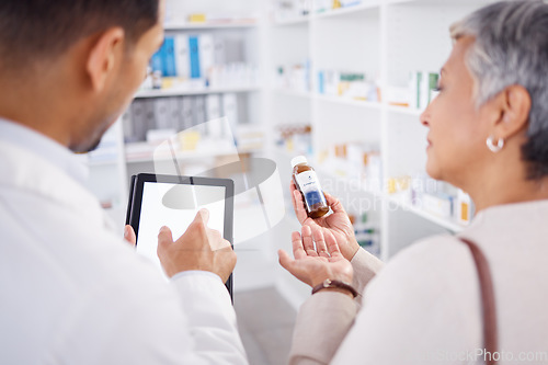 Image of Pharmacist, typing and tablet with customer, medicine and question with discussion for product info. Man, senior patient and pills with digital touchscreen for mockup, shopping or helping in pharmacy