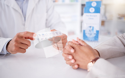 Image of Closeup, client or pharmacist with a product, hands or discussion with container with healthcare. Zoom, human or medical professional with a box, wellness or treatment in a drug store or prescription