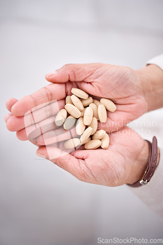 Image of Hands, pharmaceutical pills or medicine for health care or drugs for recovery, wellness or prescription supplement of vitamins. Hand, medication and support immune system with medical product